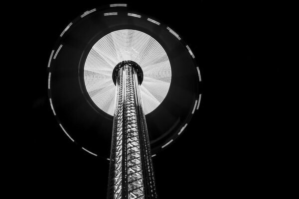 A grayscale low angle shot of the Space Needle Tower in Seattle at night